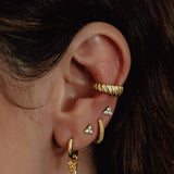 Clous d'oreilles Triconia or